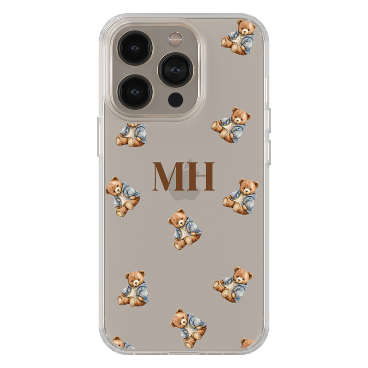 Clear iPhone case with cute teddy bear pattern and personalized brown monogram. Slim transparent phone cover for iPhone 15, iPhone 14, iPhone 13 Pro Max, and more. Stylish teddy aesthetic case offering lightweight protection with a cozy, playful vibe.