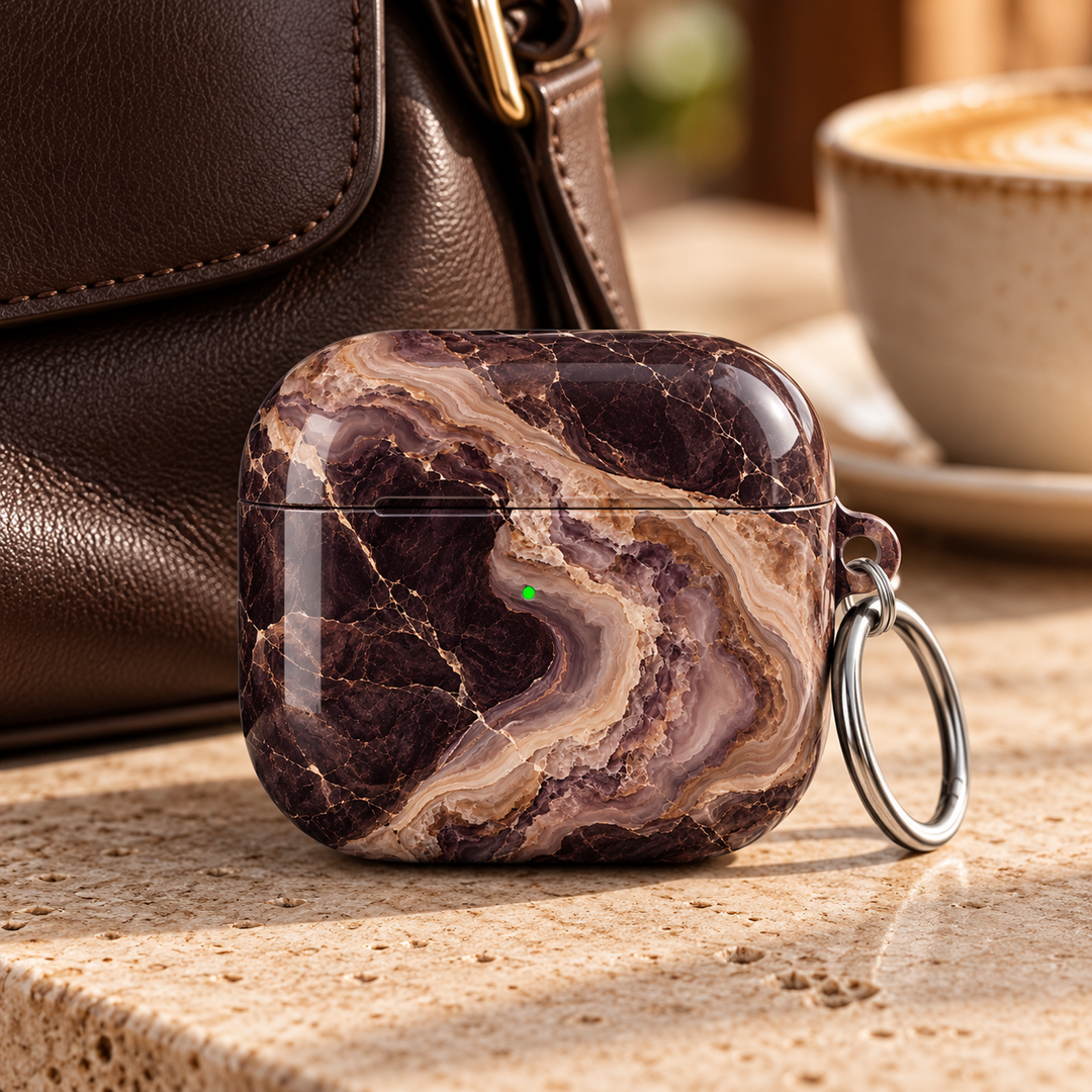 Espresso Veil AirPods Case featuring layered espresso brown, smoky plum, mocha, taupe and cream agate marble with a silver carabiner.