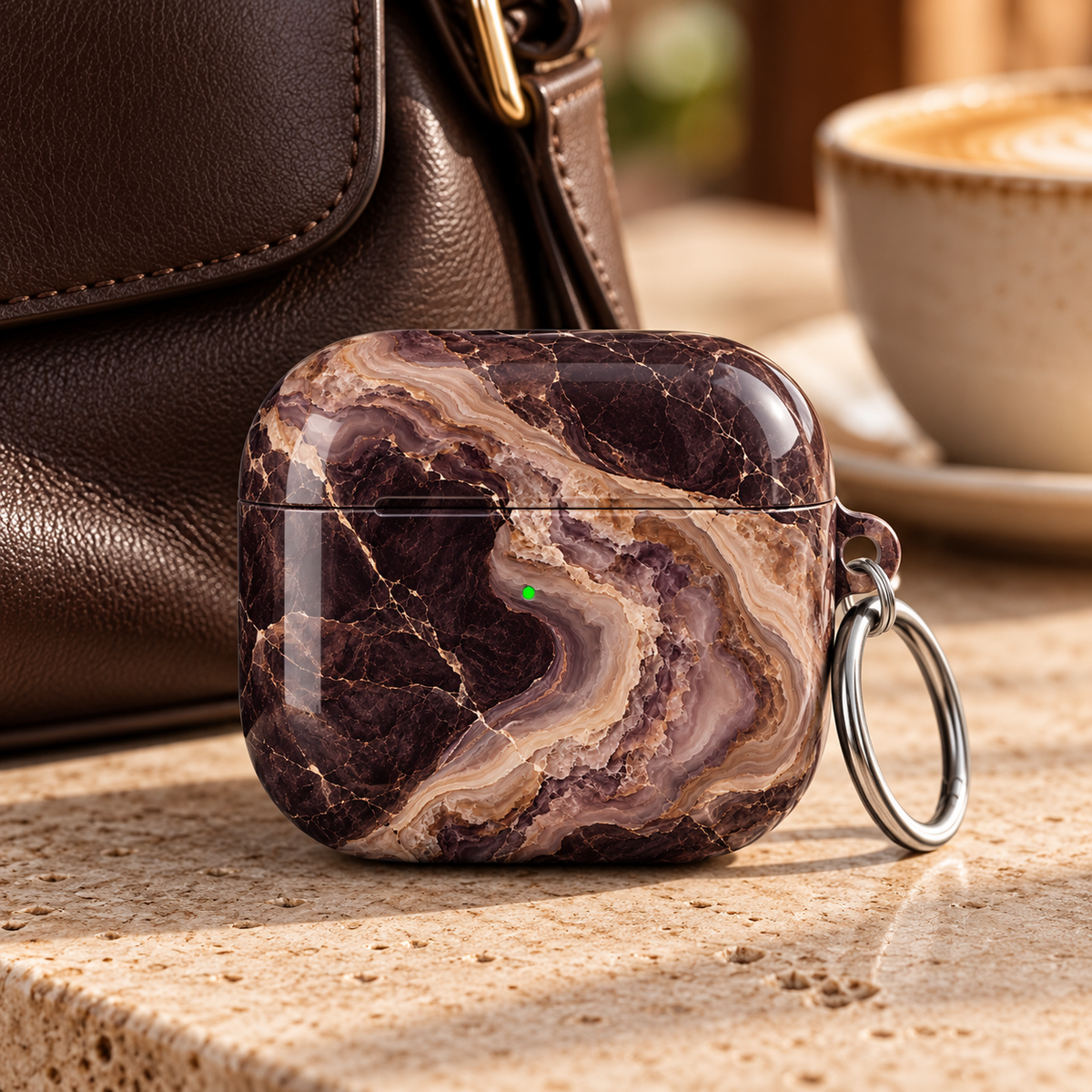 Espresso Veil AirPods Case featuring layered espresso brown, smoky plum, mocha, taupe and cream agate marble with a silver carabiner.