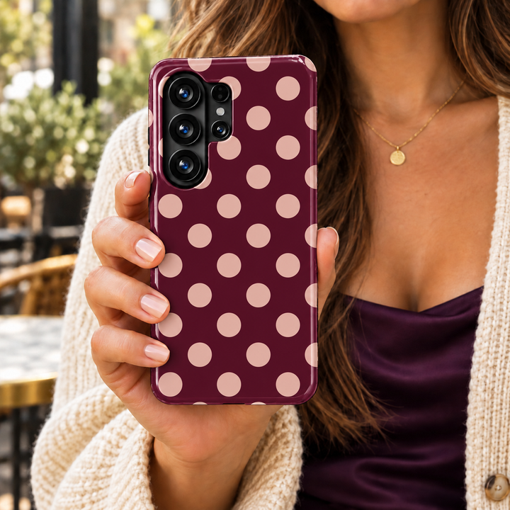 Oxblood Affair Samsung Galaxy case featuring evenly spaced blush pink polka dots on a deep burgundy background with a glossy finish.