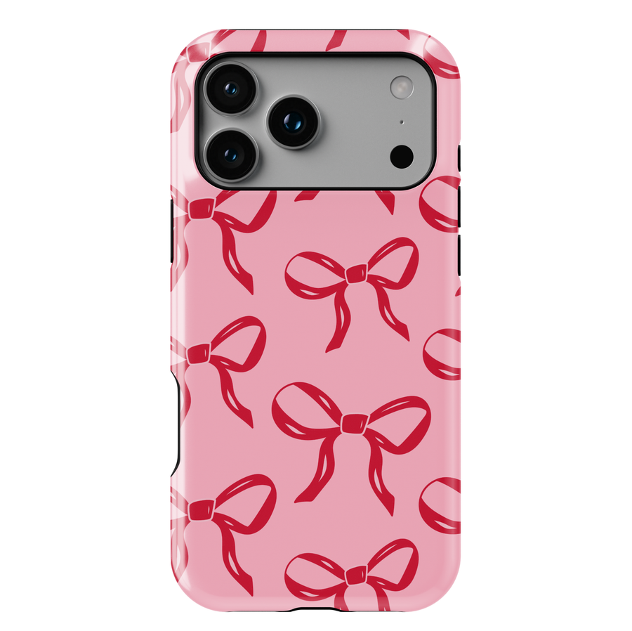 Pink phone case with red bow pattern, girly coquette aesthetic design, glossy ribbon print protective phone cover for iPhone and Samsung