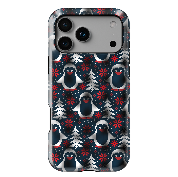 Navy blue Christmas phone case with white knitted penguins, red snowflakes, and winter trees sweater pattern