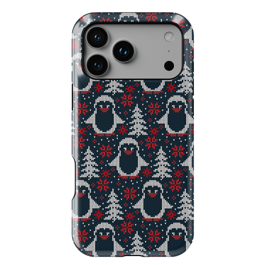 Navy blue Christmas phone case with white knitted penguins, red snowflakes, and winter trees sweater pattern