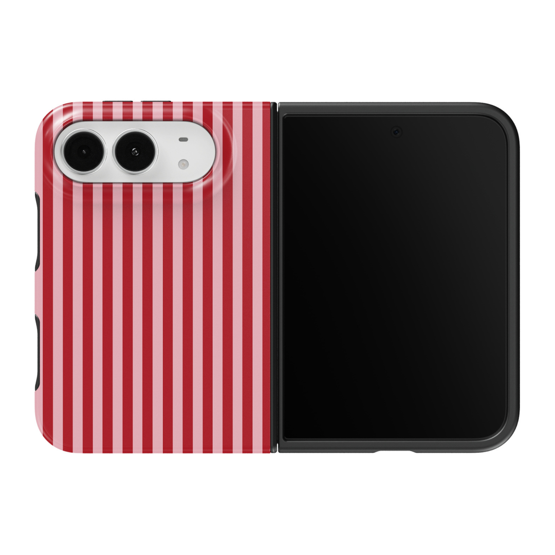 CASELIX Cherry Pinstripe iPhone Duo Tough MagSafe folding phone case featuring alternating cherry-red and soft blush-pink vertical stripes in a classic repeating pinstripe pattern. Trendy red and pink striped phone case for women with a glossy printed finish, feminine coquette aesthetic, vintage candy stripe design, retro preppy fashion style, minimalist geometric artwork, and protective two-piece foldable construction.