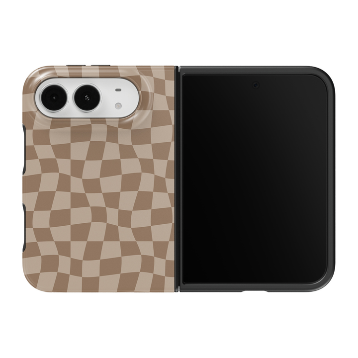 CASELIX Sandstone Wave Check iPhone Duo Tough MagSafe folding phone case featuring a flowing wavy checkerboard pattern in warm taupe, sandy beige, and soft ivory tones, with gently curved geometric squares creating a subtle retro optical illusion. Trendy neutral beige checkered phone case for women with a glossy printed finish, minimalist quiet luxury aesthetic, 70s-inspired groovy checkerboard artwork, modern coastal chic style, elegant earth-tone geometric design, and protective two-piece foldable constru
