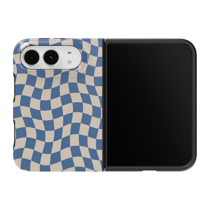 CASELIX Coastal Wave Check iPhone Duo Tough MagSafe folding phone case featuring a flowing wavy checkerboard pattern in muted dusty blue and warm ivory beige, with gently curved geometric squares creating a retro optical wave effect. Trendy blue checkered phone case for women with a glossy printed finish, coastal chic aesthetic, 70s-inspired groovy checkerboard design, minimalist geometric artwork, vintage preppy fashion style, and protective two-piece foldable construction.
