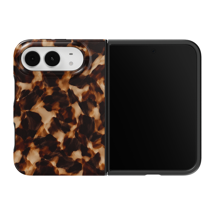CASELIX Amber Tortoise iPhone Duo Tough MagSafe folding phone case featuring a classic brown tortoiseshell pattern with rich amber, honey caramel, dark espresso, glossy black, and warm golden-beige marbled accents. Elegant tortoise shell print phone case for women with a glossy printed finish, vintage resin-inspired aesthetic, timeless quiet luxury style, chic neutral fashion design, and protective two-piece foldable construction.