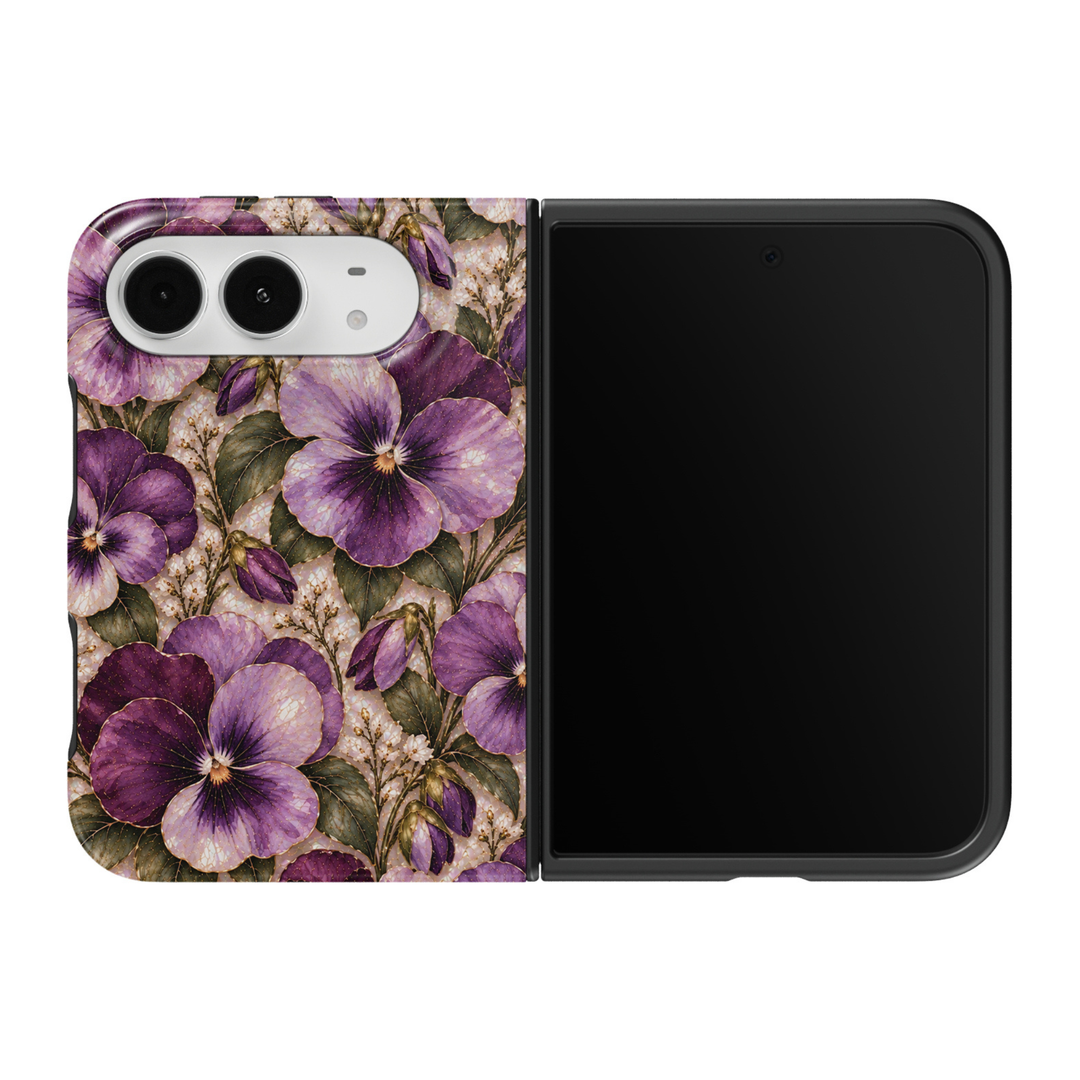 CASELIX February Violet iPhone Duo Tough MagSafe folding phone case featuring elegant purple violet flowers with lavender and deep amethyst petals, delicate violet buds, sage-green botanical leaves, tiny ivory blossoms, and intricate champagne-gold detailing over a pearlescent stained-glass-inspired background. Beautiful February birth flower phone case for women with a glossy printed finish, romantic cottagecore aesthetic, vintage botanical floral artwork, and protective two-piece foldable construction. Th