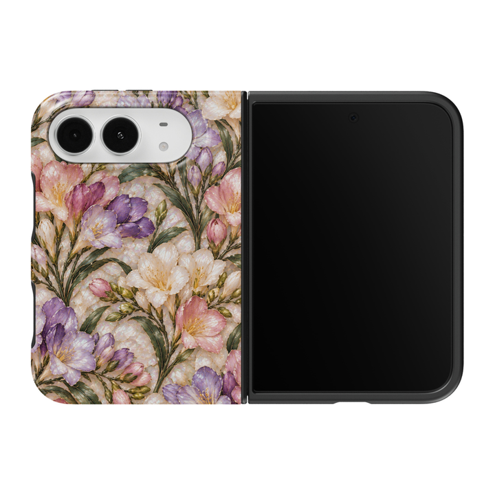 CASELIX Spring Freesia iPhone Duo Tough MagSafe folding phone case featuring delicate lavender-purple, blush-pink, and ivory-white freesia flowers with golden stamens, graceful flower buds, sage-green botanical leaves, and intricate champagne-gold detailing over a luminous pearlescent stained-glass-inspired background. Elegant pastel floral phone case for women with a glossy printed finish, romantic cottagecore aesthetic, vintage spring garden artwork, feminine botanical design, and protective two-piece fol