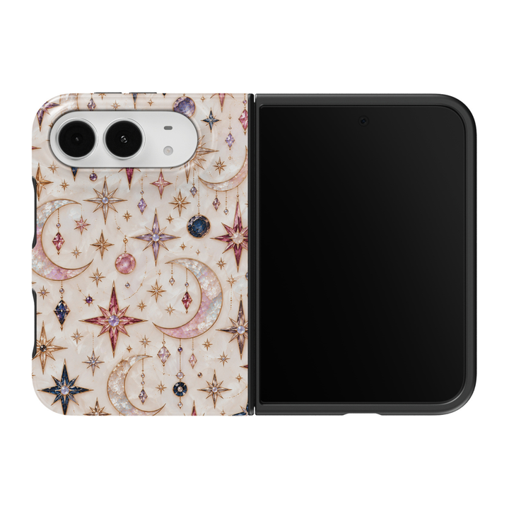 CASELIX Celestial Dreams iPhone Duo Tough MagSafe folding phone case featuring iridescent crescent moons, sparkling gold eight-pointed stars, pink and lavender gemstone-inspired ornaments, sapphire-blue celestial accents, and delicate hanging crystal illustrations over a luminous ivory mother-of-pearl-inspired background. Elegant celestial phone case for women with a glossy printed finish, dreamy moon and stars aesthetic, mystical astrology-inspired artwork, feminine cosmic design, and protective two-piece 