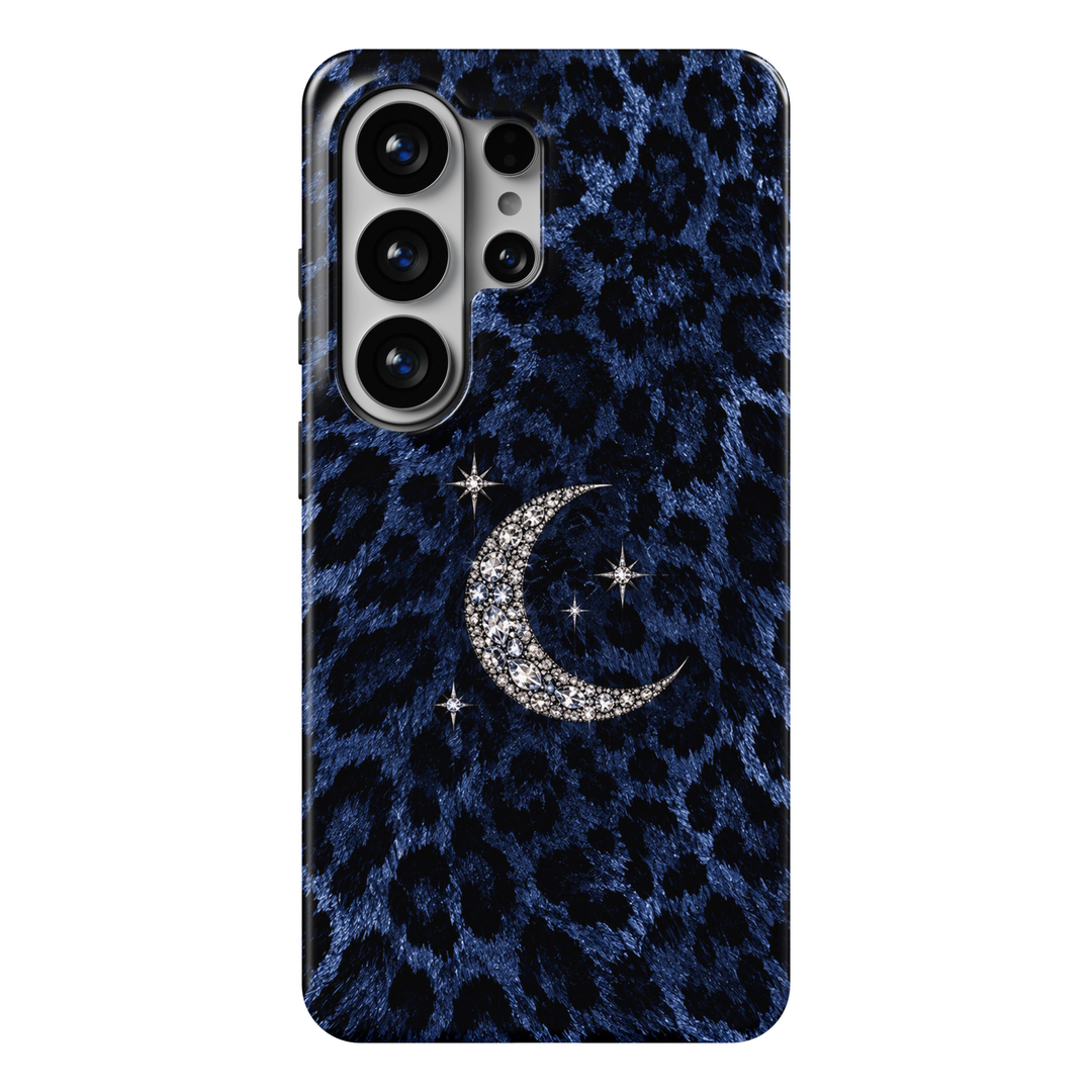 CASELIX Midnight Moon Leopard Samsung Galaxy S26 Ultra Tough MagSafe protective phone case featuring a luxurious deep sapphire-blue and midnight-black leopard print pattern adorned with a sparkling silver crescent moon and delicate crystal stars. The sophisticated design showcases irregular black leopard spots against a richly textured royal-blue, faux-fur-inspired background, creating a bold and mysterious animal print aesthetic. At the center, an elegant crescent moon features intricately arranged diamond
