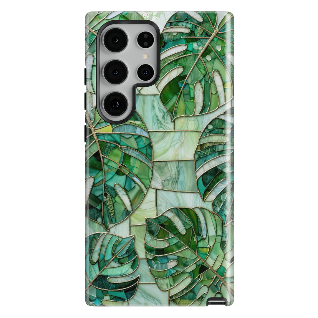 Samsung Galaxy case featuring emerald green monstera leaves in a stained glass botanical mosaic design.