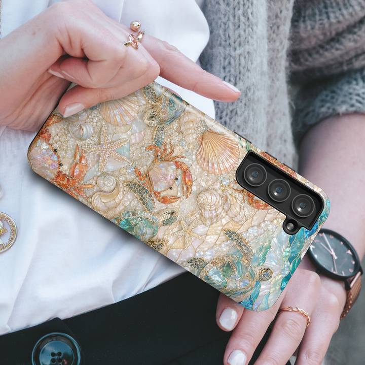 Coastal Samsung Galaxy case featuring sea turtles, starfish, seashells, pearl accents, and tropical beach-inspired ocean artwork.