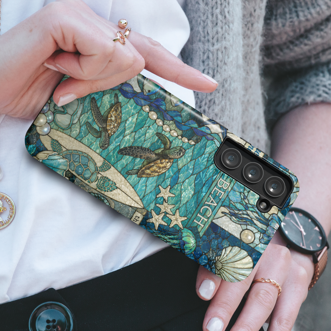 Coastal Samsung Galaxy S26 Ultra phone case with sea turtles, ocean waves, shells, and beach-inspired stained glass artwork.