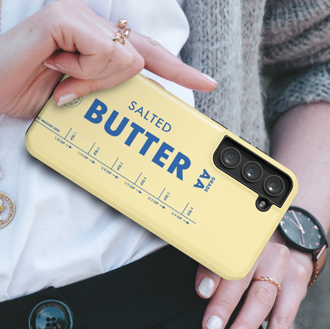 Butter yellow Samsung Galaxy phone case featuring vintage salted butter packaging design with bold blue typography and retro dairy aesthetic.