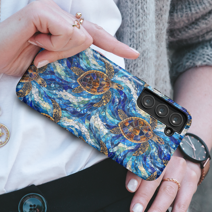 Sea turtle Samsung Galaxy case featuring ocean waves, marine life artwork, stained glass style turtles, and vibrant blue coastal colors.