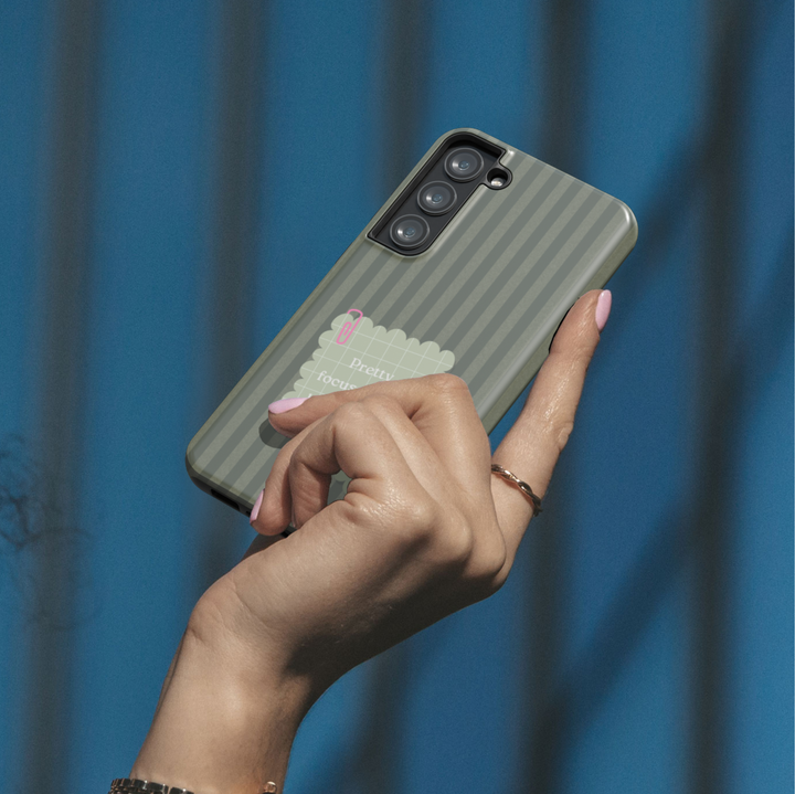 Olive green striped phone case with pretty focused and unbothered quote on a Samsung Galaxy protective phone case