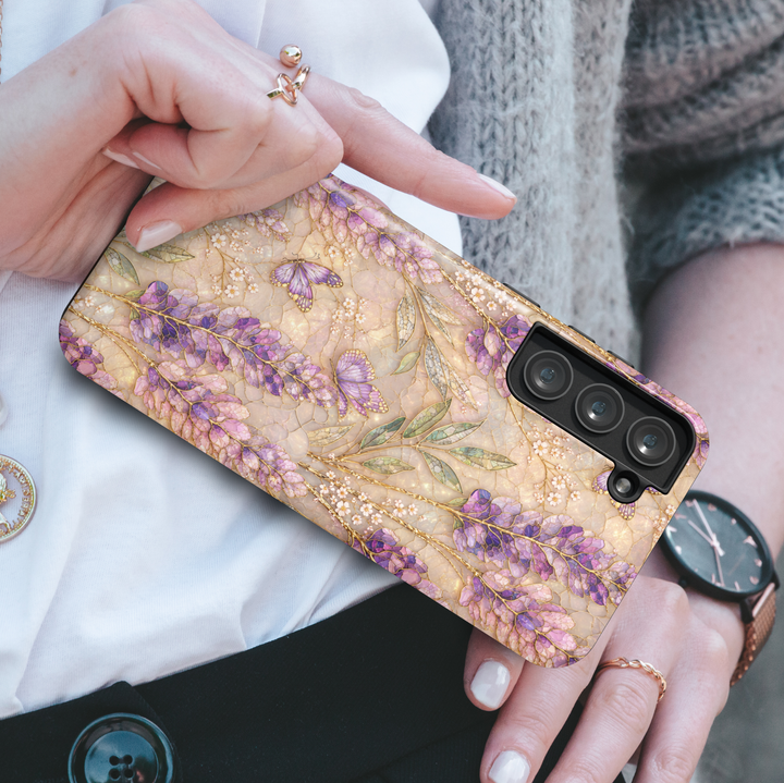 Elegant lavender butterfly phone case featuring purple wildflowers, delicate butterflies, gold botanical details, and a soft pearl-inspired background.