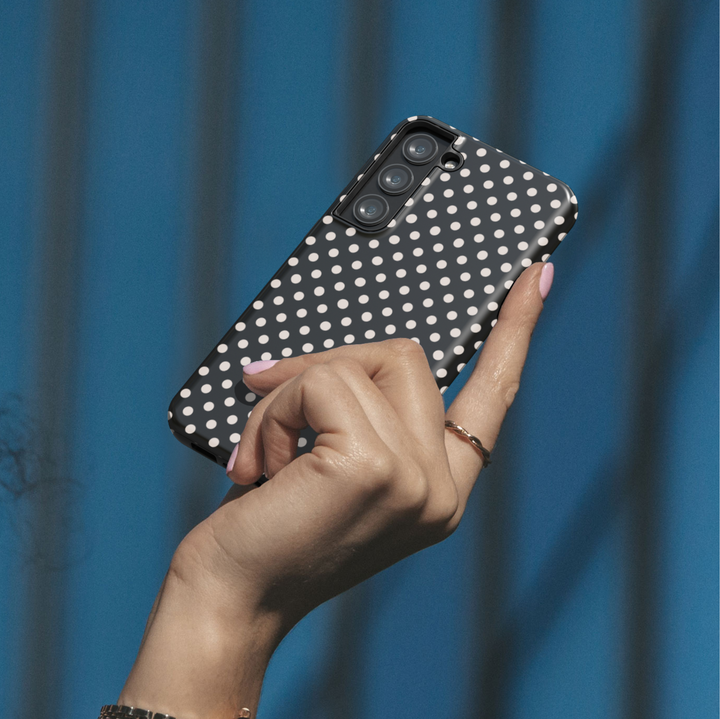 Black polka dot personalized phone case with custom name on a protective iPhone and Samsung Galaxy phone case