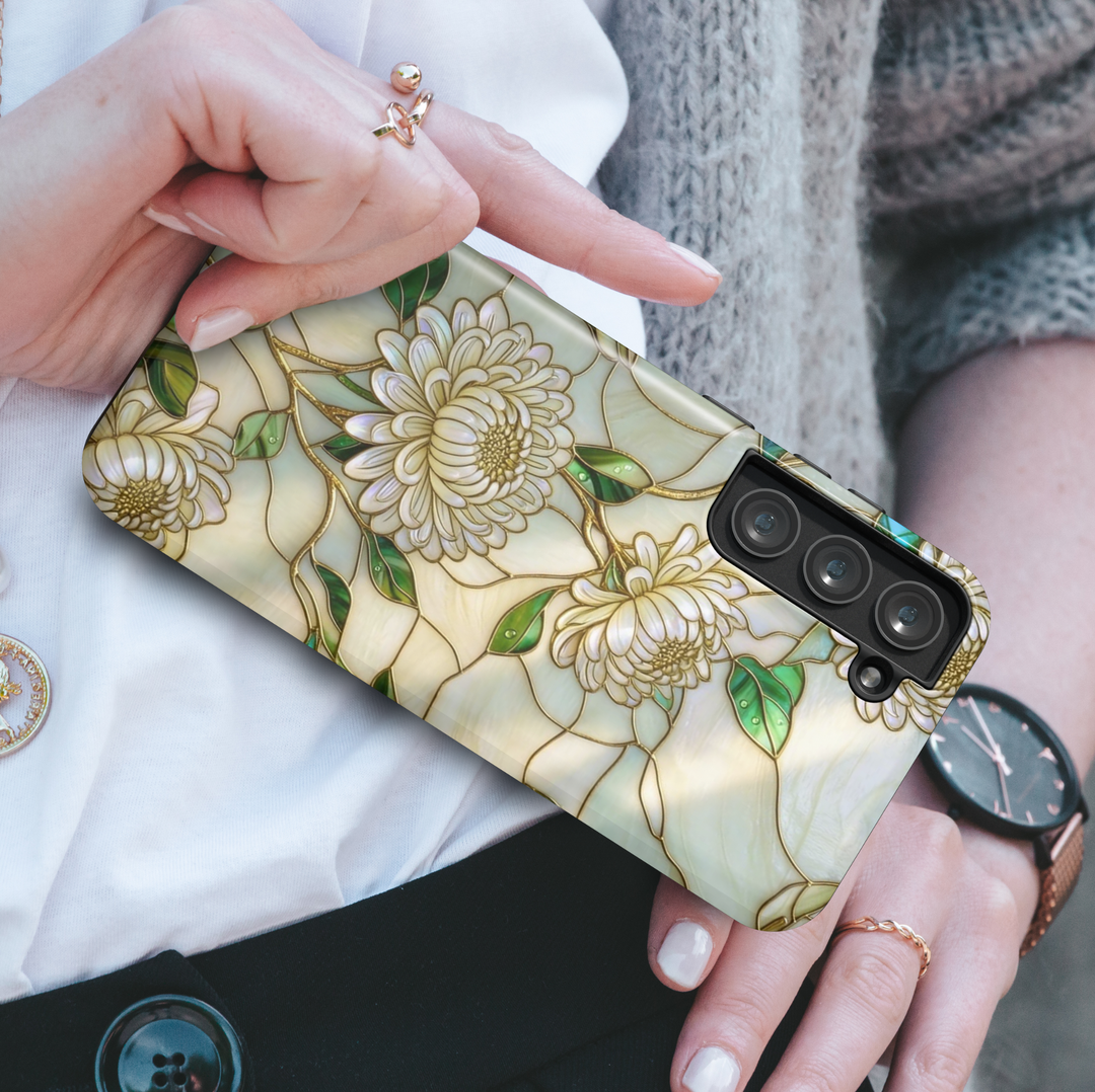 Ivory floral Samsung Galaxy S26 Ultra case with white chrysanthemum flowers and gold accents, elegant protective phone case.