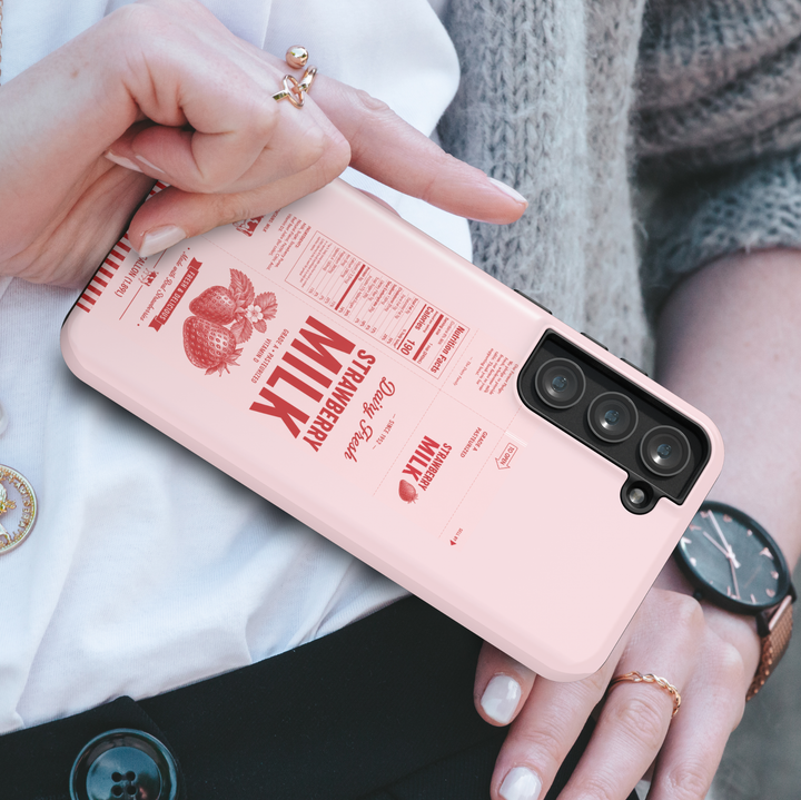 Pink strawberry milk carton Samsung Galaxy phone case featuring vintage dairy packaging design, strawberries, and retro food aesthetic artwork.