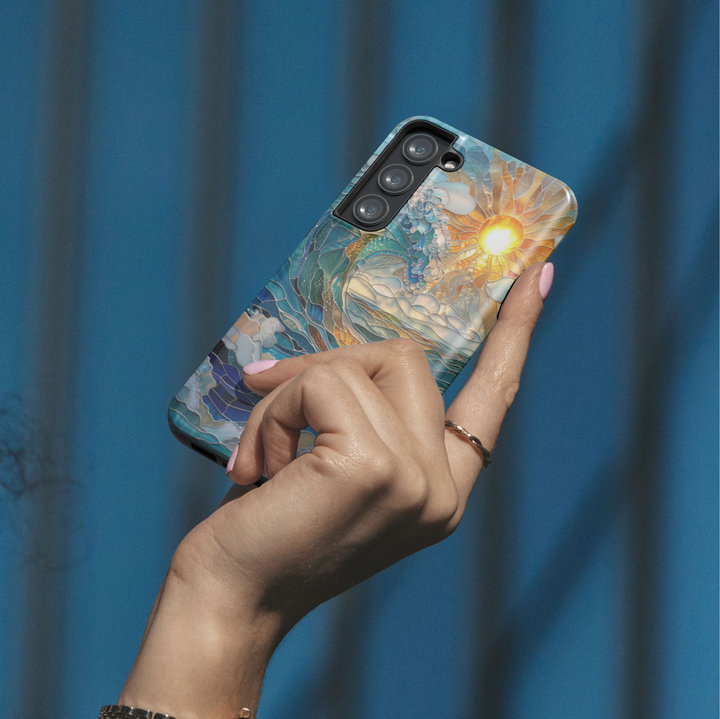 Ocean sunrise stained glass art phone case with blue waves and golden sun on a protective iPhone and Samsung Galaxy phone case