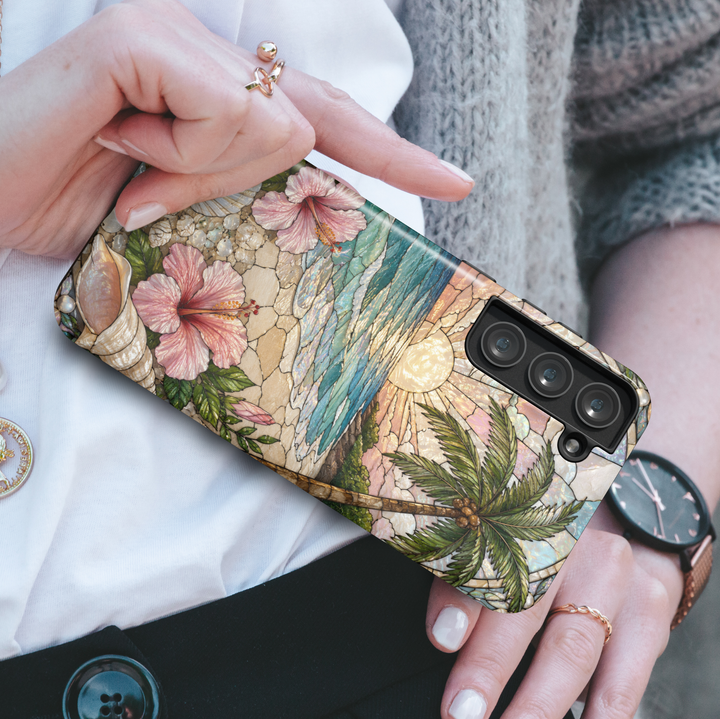 Tropical Samsung Galaxy S26 Ultra case featuring hibiscus flowers, beach sunset scenery, seashells, and ocean waves.