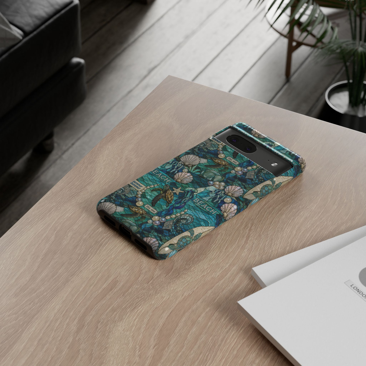 Google Pixel 10 Pro protective phone case featuring sea turtles, pearls, seashells, jellyfish, and deep blue ocean mosaic artwork with premium dual-layer drop protection.