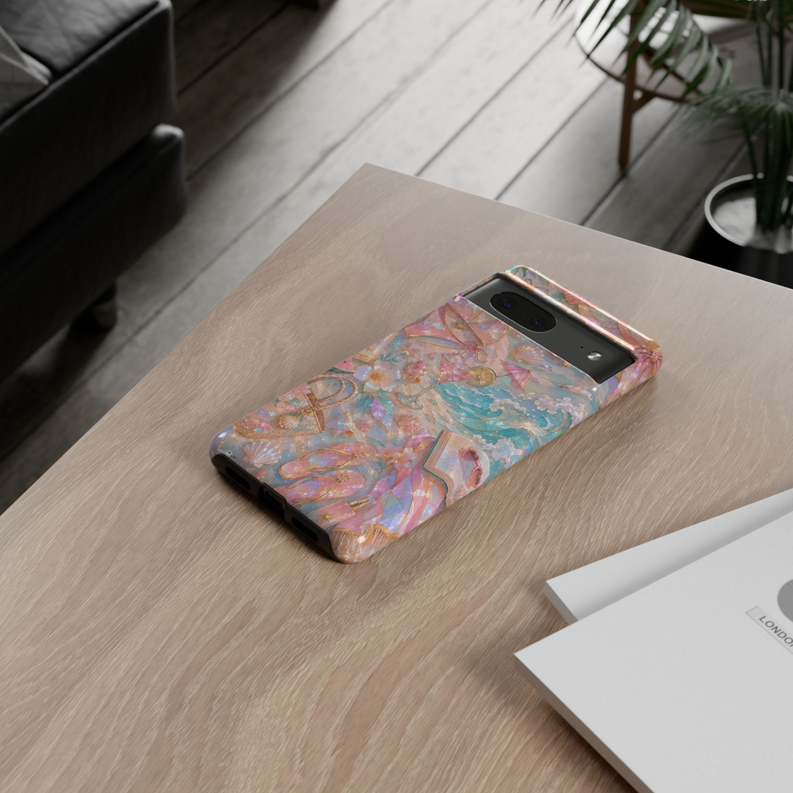 Google Pixel 10 Pro protective phone case featuring pastel beach club artwork with pink cocktails, seashells, ocean waves, tropical flowers, and shimmering pearl details on a durable dual-layer case.