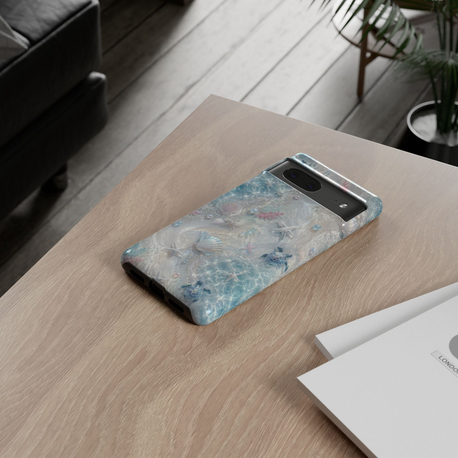 Google Pixel 10 Pro protective phone case featuring shimmering turquoise ocean waves, iridescent seashells, pearls, sea turtles, starfish, and soft coastal artwork with premium dual-layer protection.