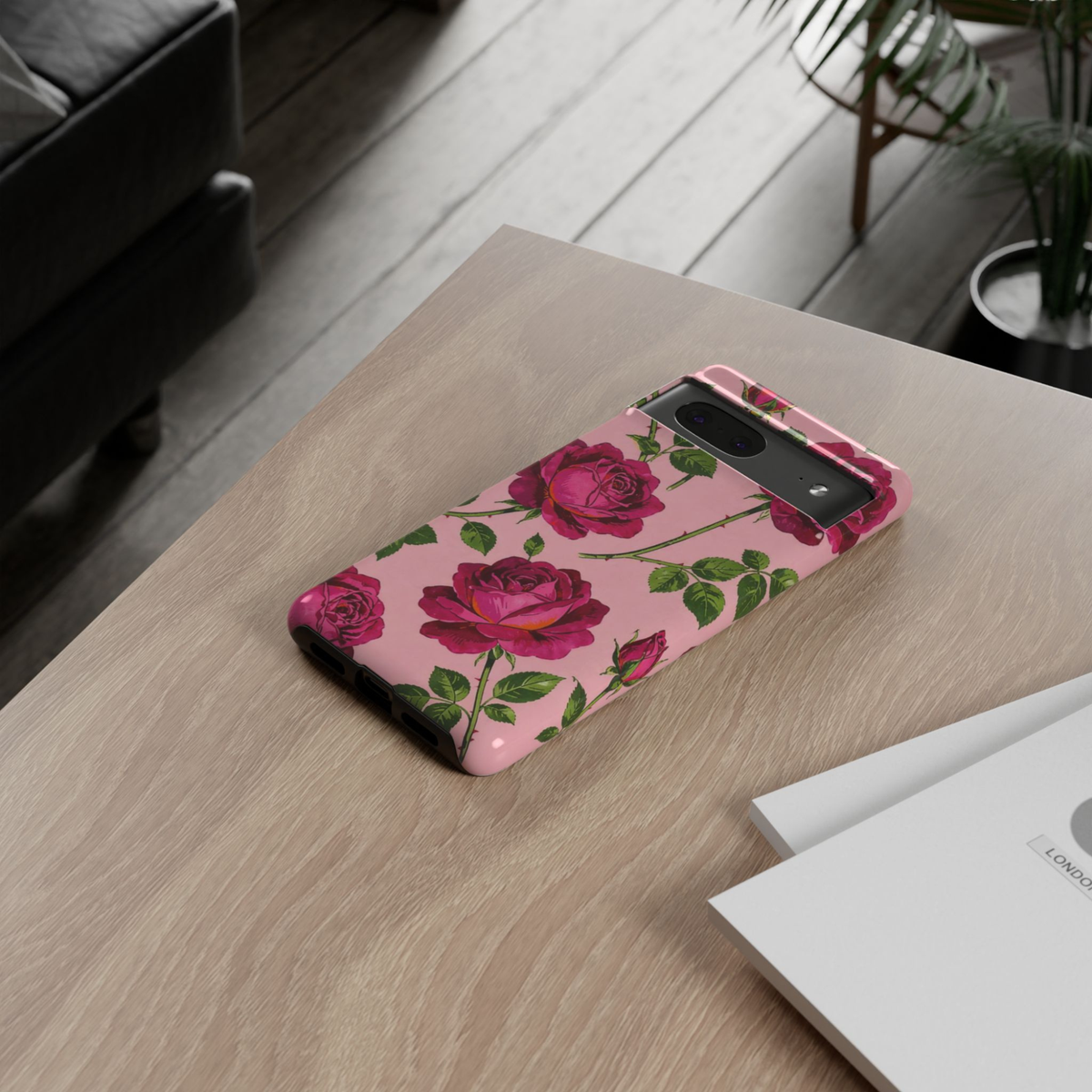 Google Pixel 10 Pro protective phone case featuring vintage magenta roses with green leaves on a blush pink background, offering durable dual-layer protection and elegant botanical style.