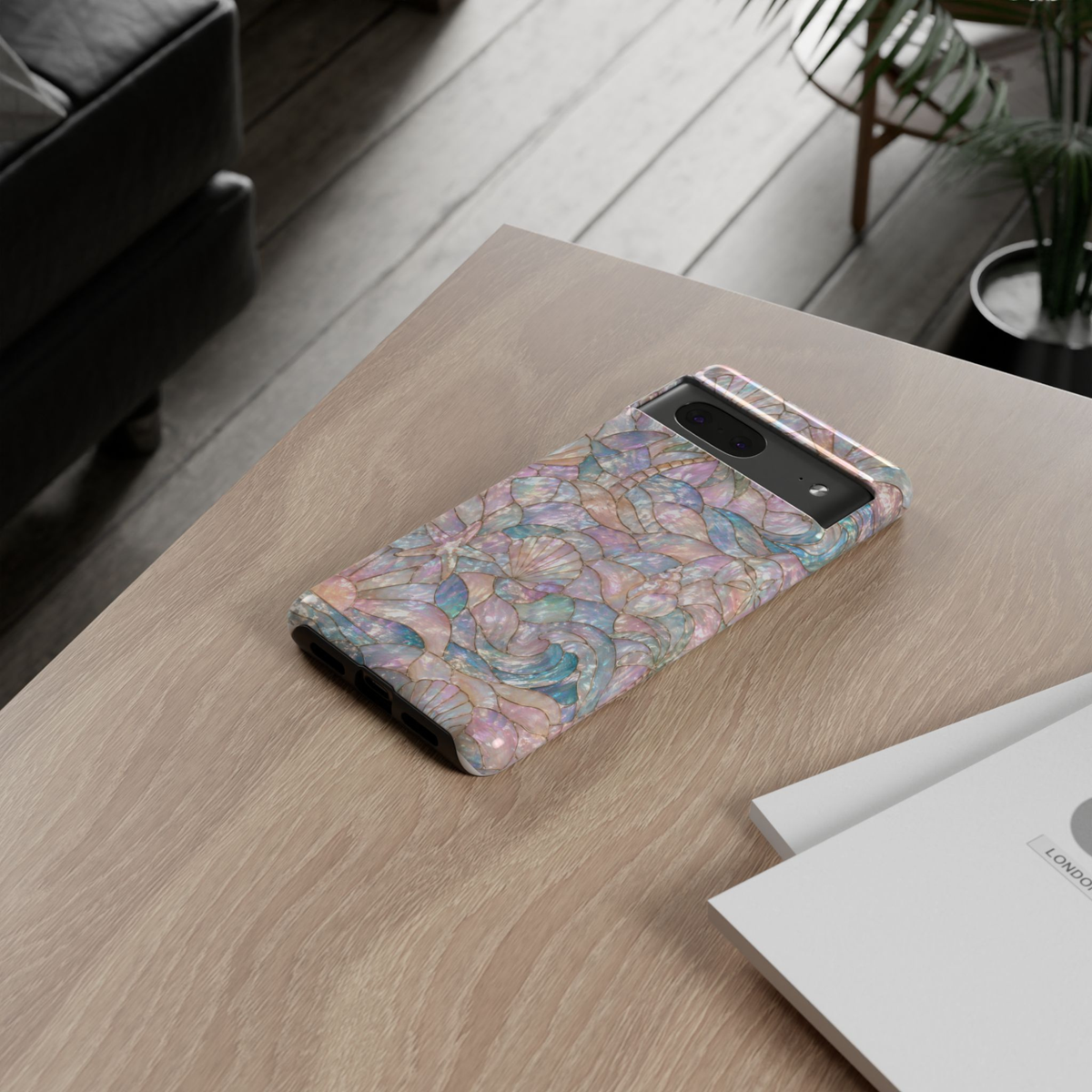 Pearl Tide Google Pixel 10 Pro protective phone case featuring iridescent mother-of-pearl stained glass artwork with ocean waves, seashells, starfish, and pastel coastal colors.