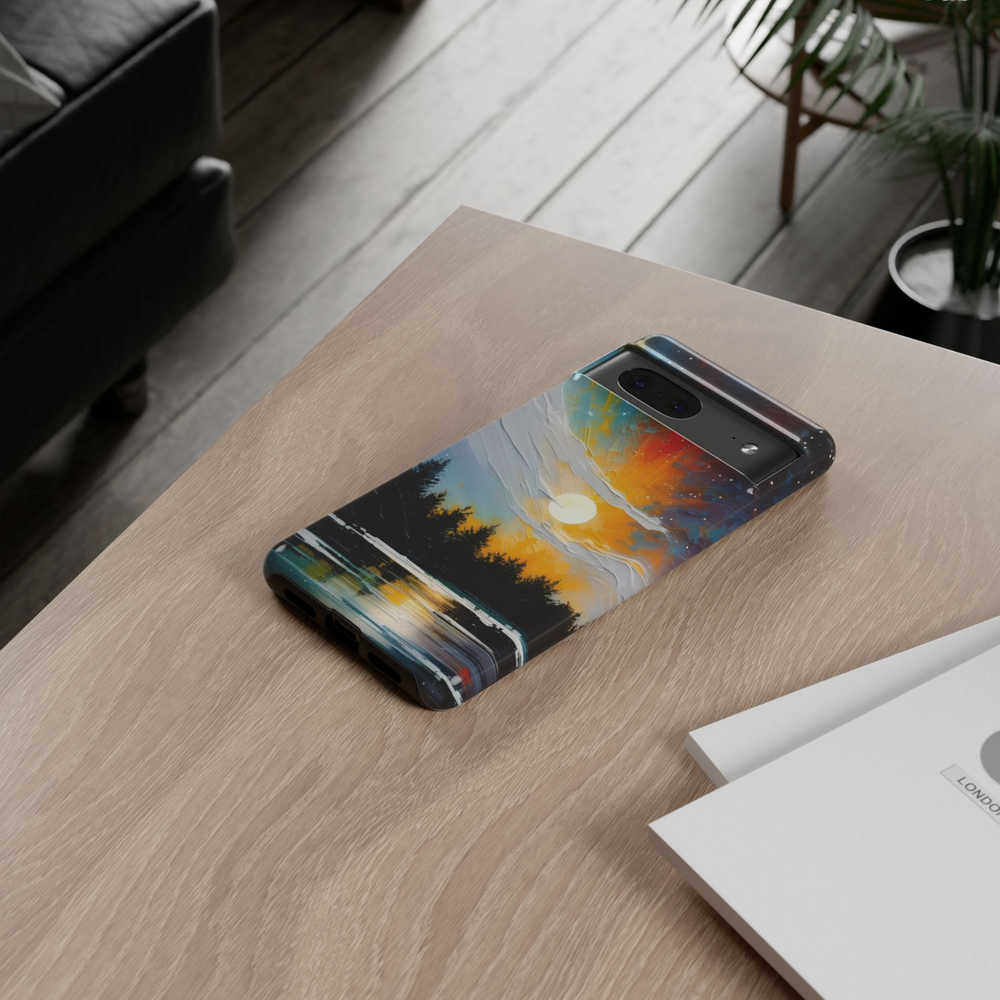 Solstice Lake Google Pixel 10 Pro protective phone case featuring a glowing sunset over a tranquil mountain lake with pine tree silhouettes and reflective water.