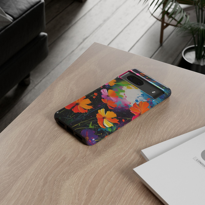 Neon Botanica Google Pixel 10 Pro protective phone case featuring vibrant orange and pink cosmos flowers on a colorful abstract black background with expressive paint splashes.