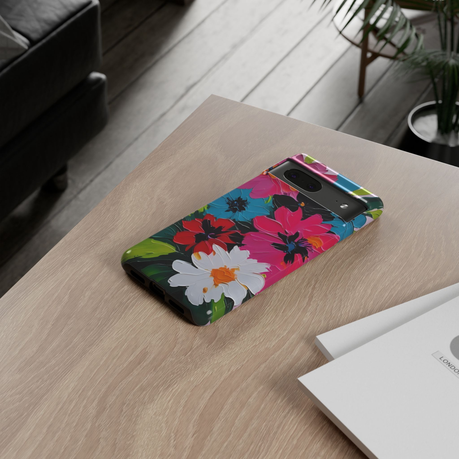 Velvet Bloom Google Pixel 10 Pro protective phone case featuring vibrant hand-painted flowers in pink, blue, red, white, and green on a dramatic dark background.