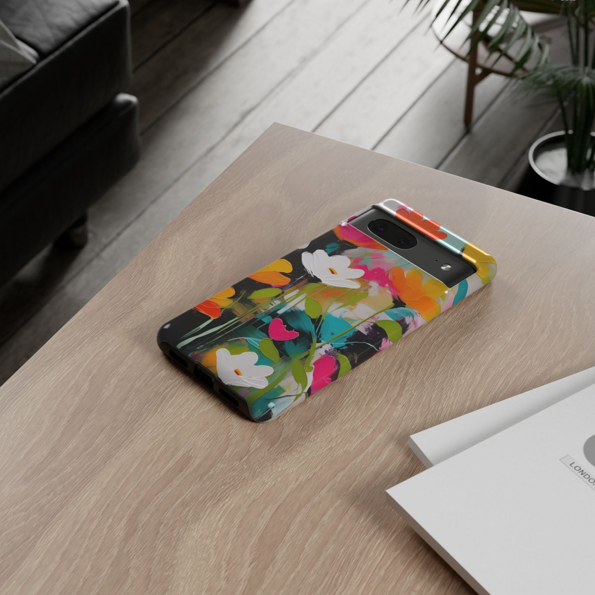 Color Theory Google Pixel 10 Pro protective phone case featuring bold white flowers on a colorful abstract painted background with vibrant pink, teal, orange, and yellow accents.