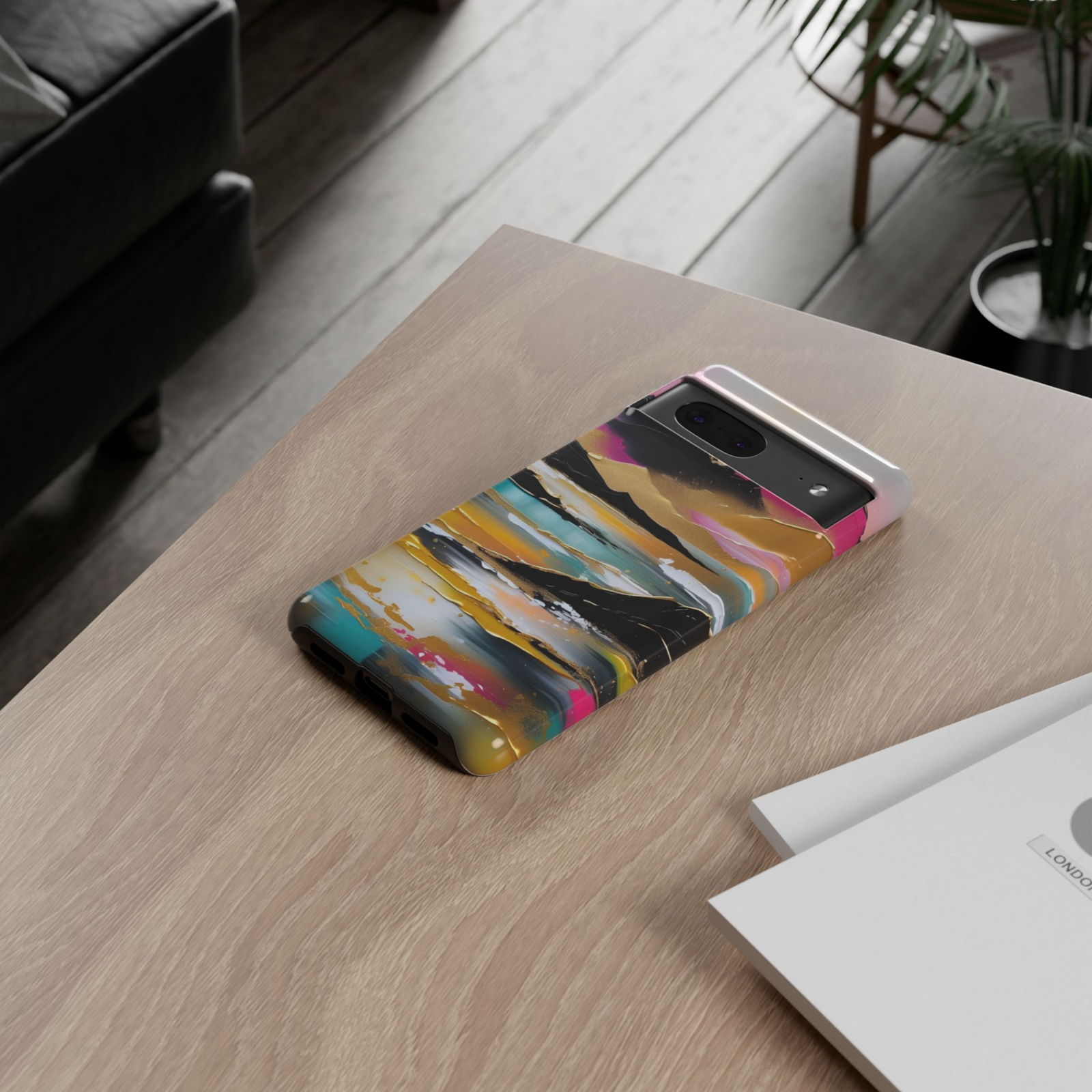 Golden Mirage Google Pixel 10 Pro protective phone case featuring an abstract coastal landscape with gold accents, turquoise water, black mountains, and a colorful sunset sky.