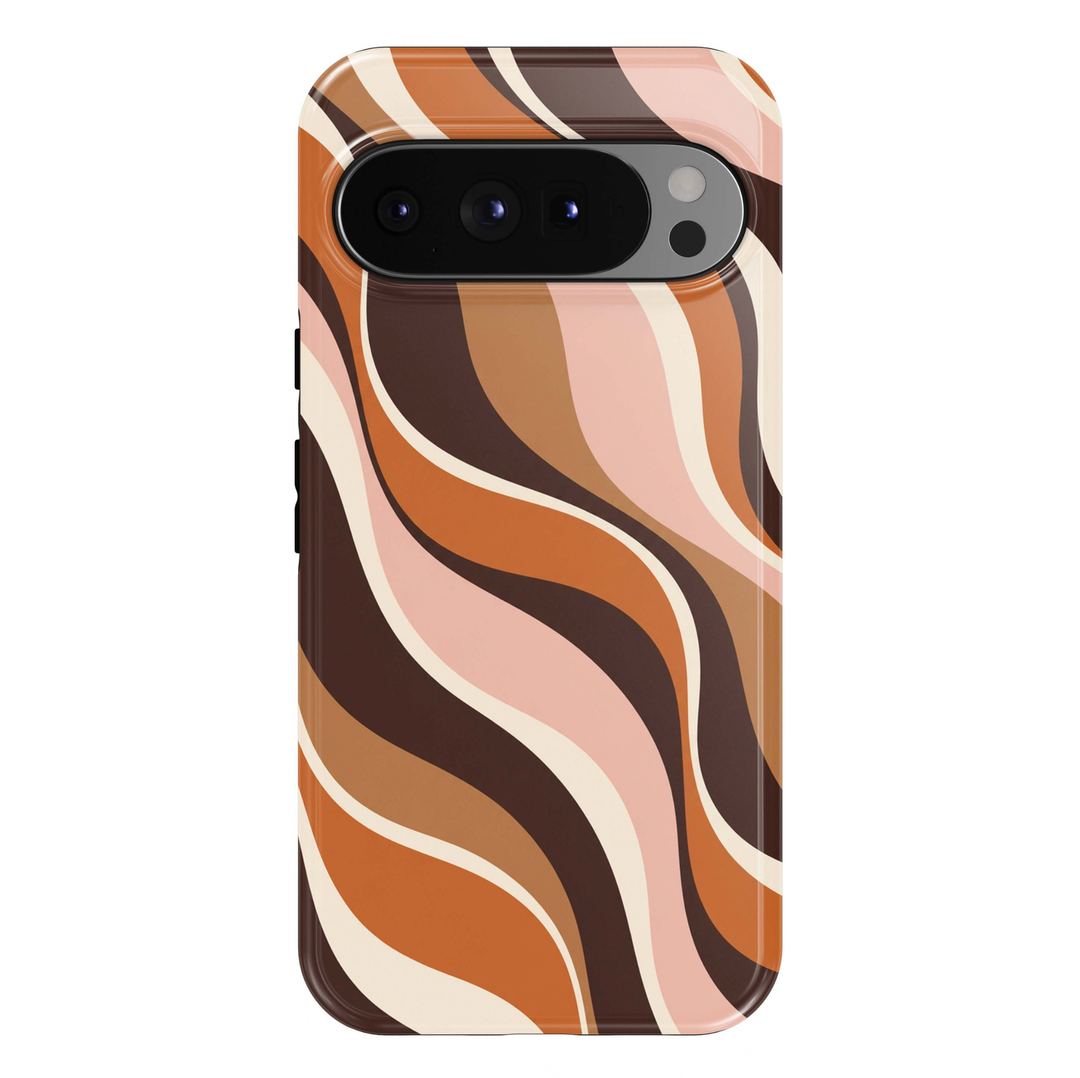 Caramel Retro Waves Google Pixel case featuring bold flowing retro stripes in warm caramel orange, espresso brown, soft blush pink and ivory cream. A trendy 70s-inspired abstract wave design with a glossy finish.