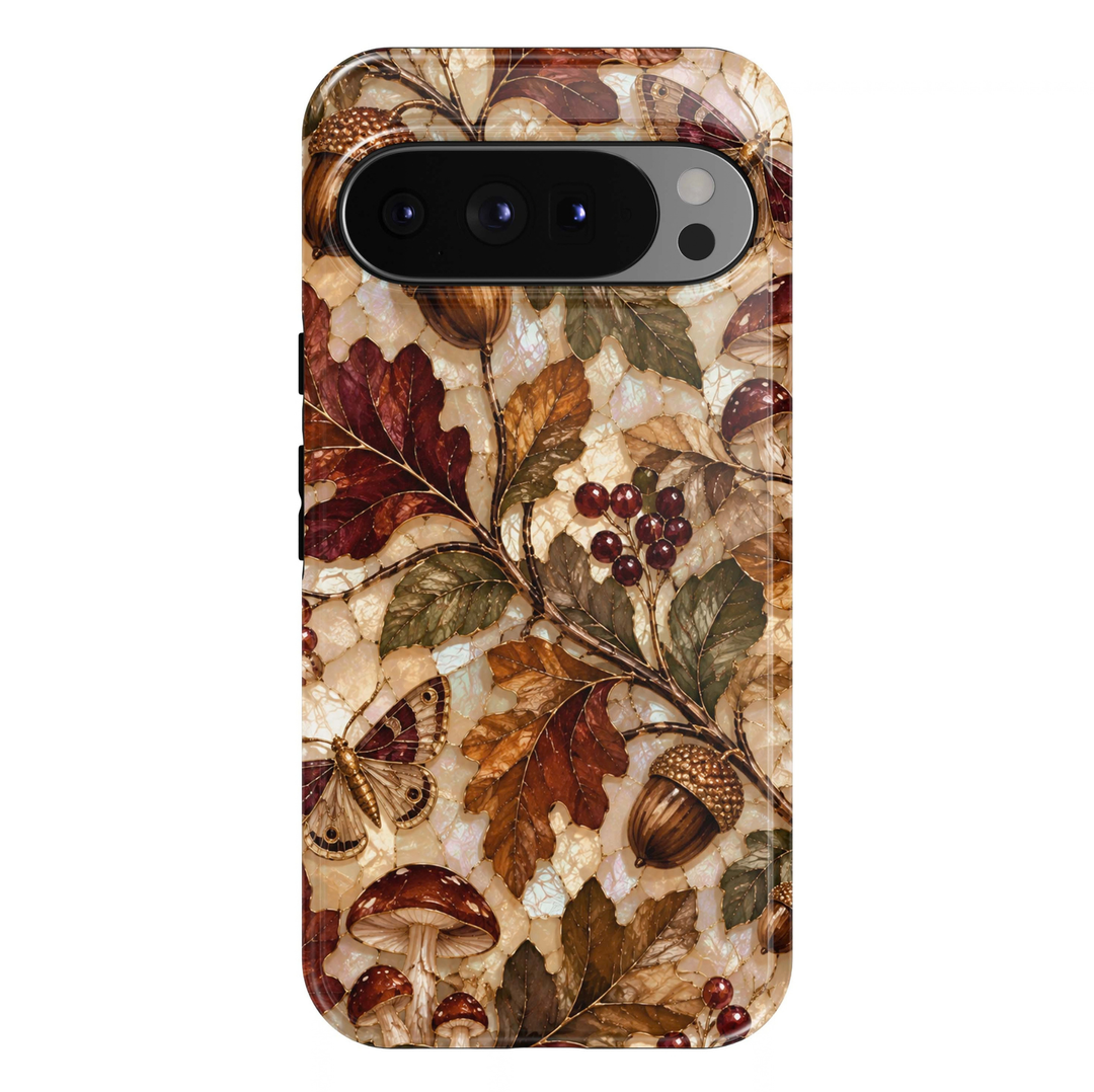 Enchanted Autumn Forest Google Pixel case featuring elegant oak leaves in rich burgundy, copper, amber and olive green, golden acorns, woodland mushrooms, delicate moths and clusters of ruby-red berries. An iridescent ivory mosaic background with fine gold detailing creates a luxurious, whimsical autumn woodland design with a glossy finish.