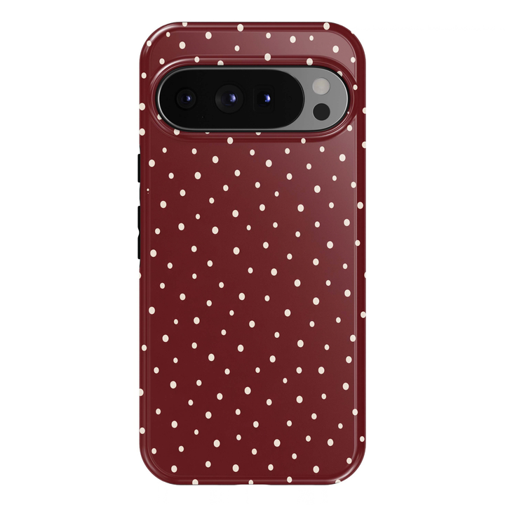 Burgundy Polka Dots Google Pixel case featuring a rich wine-red background with scattered ivory-white polka dots in varying sizes. The playful, minimalist dotted pattern creates a timeless, chic and feminine aesthetic with a glossy finish.