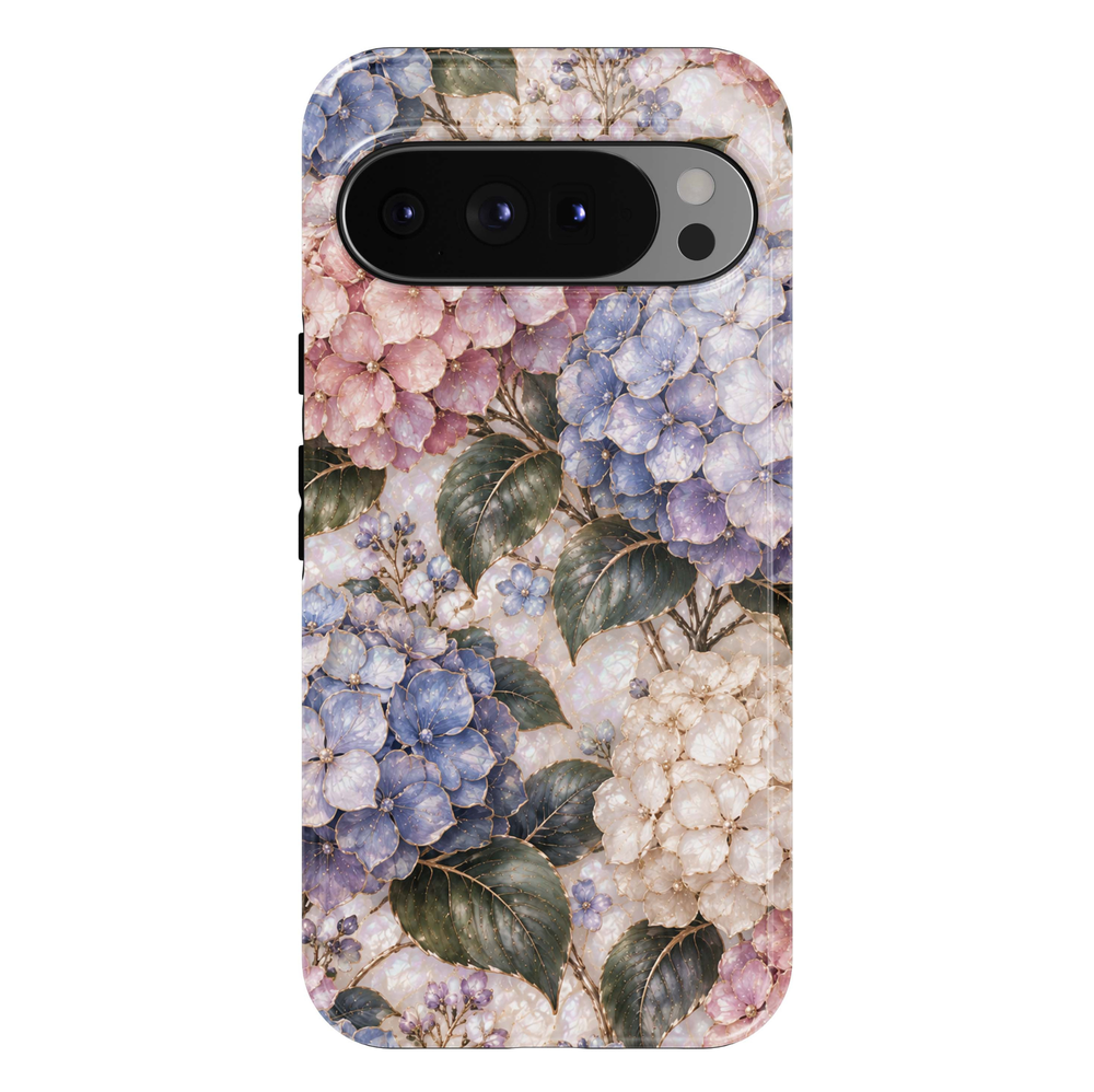 Blushing Hydrangea Google Pixel case featuring soft blush-pink, powder blue, lavender and ivory hydrangea blossoms with sage-green leaves, delicate gold botanical accents and a luminous pearl-inspired background.