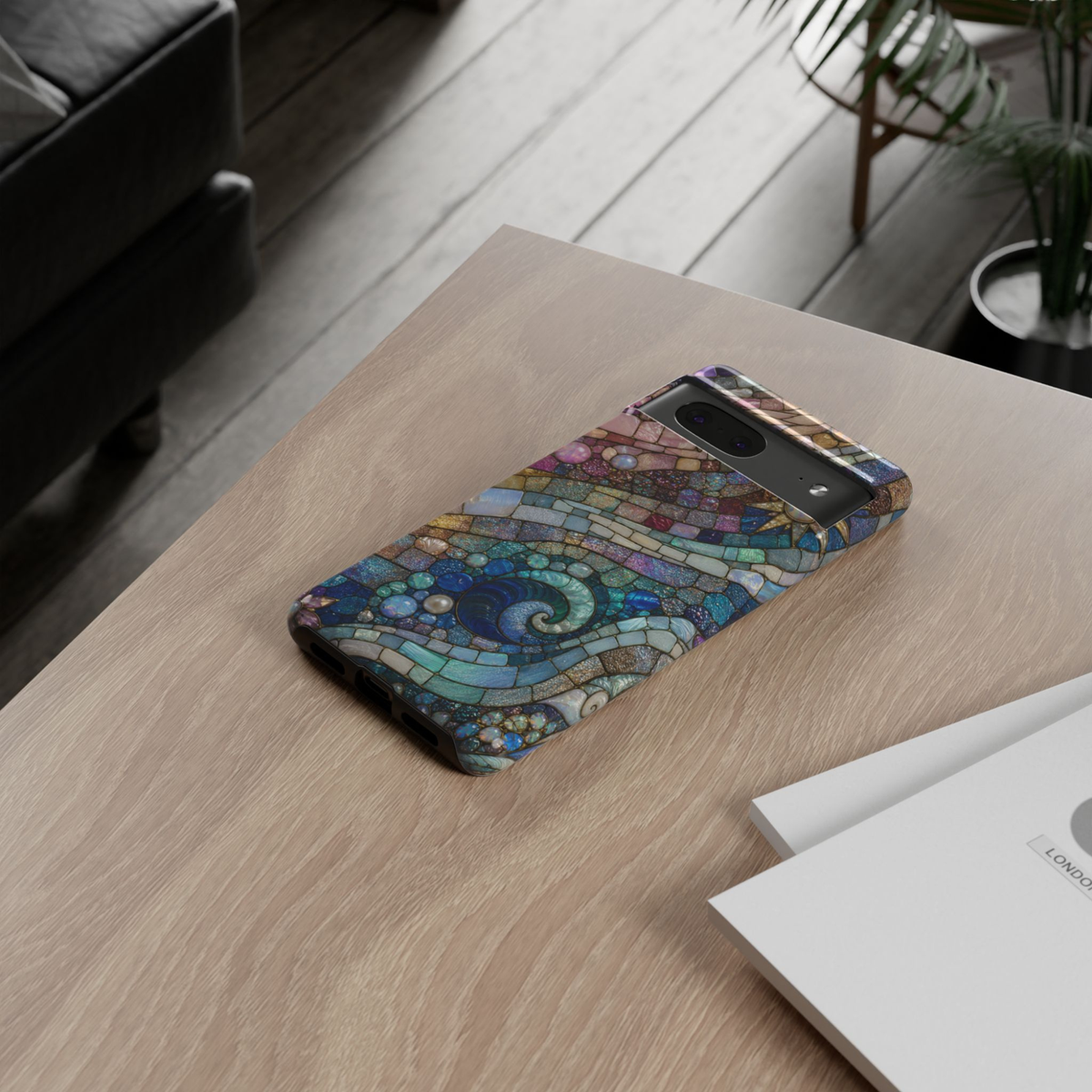 Google Pixel 10 protective phone case featuring a stained glass mosaic of swirling ocean waves with shimmering pearls, gemstones, and celestial sky in blue, teal, lavender, and gold tones.