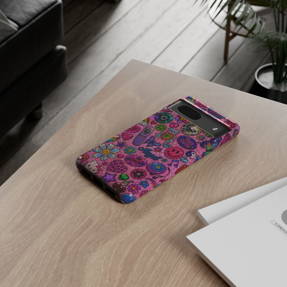 Google Pixel 10 protective phone case featuring a colorful Y2K pink sticker collage with smiley faces, hearts, butterflies, teddy bear, disco ball, flip phone, flowers, cherries, and retro aesthetic icons.