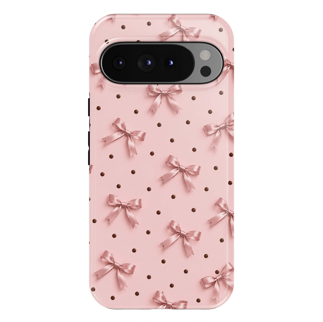 Blush &amp; Bows Google Pixel phone case featuring delicate blush pink satin bows and tiny chocolate brown polka dots on a soft pink background.