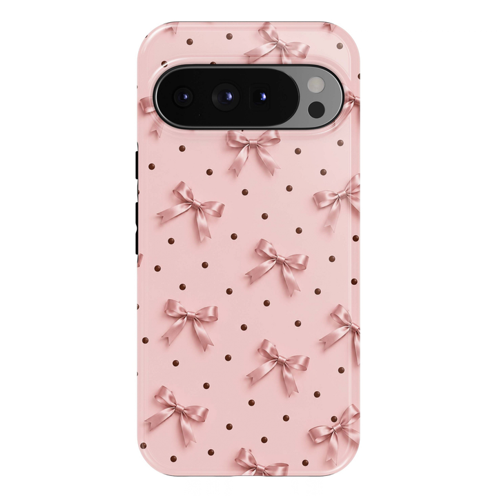 Blush &amp; Bows Google Pixel phone case featuring delicate blush pink satin bows and tiny chocolate brown polka dots on a soft pink background.