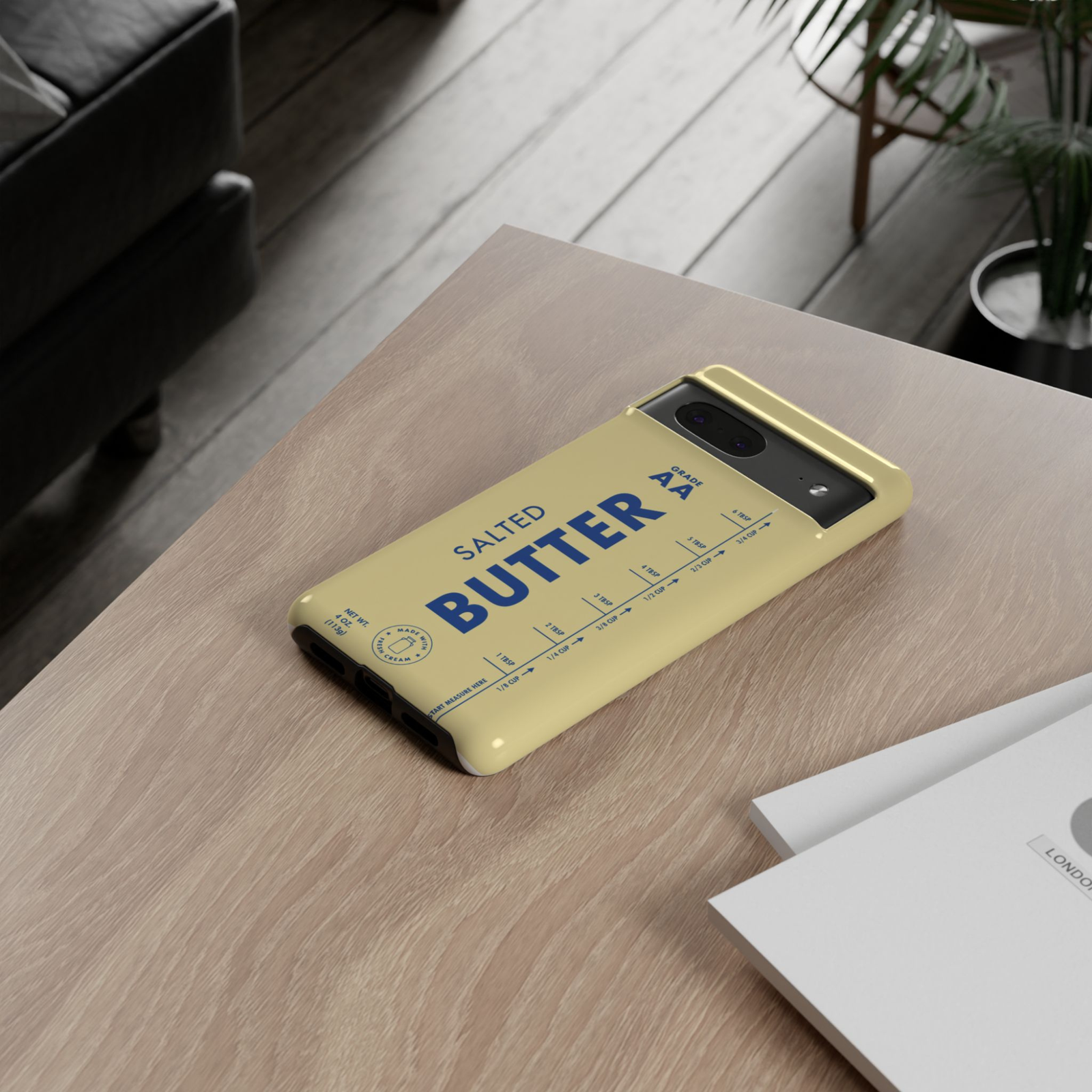 Protective Google Pixel 10 Pro phone case featuring a vintage salted butter stick label with butter-yellow background, bold blue typography, and retro kitchen-inspired design.
