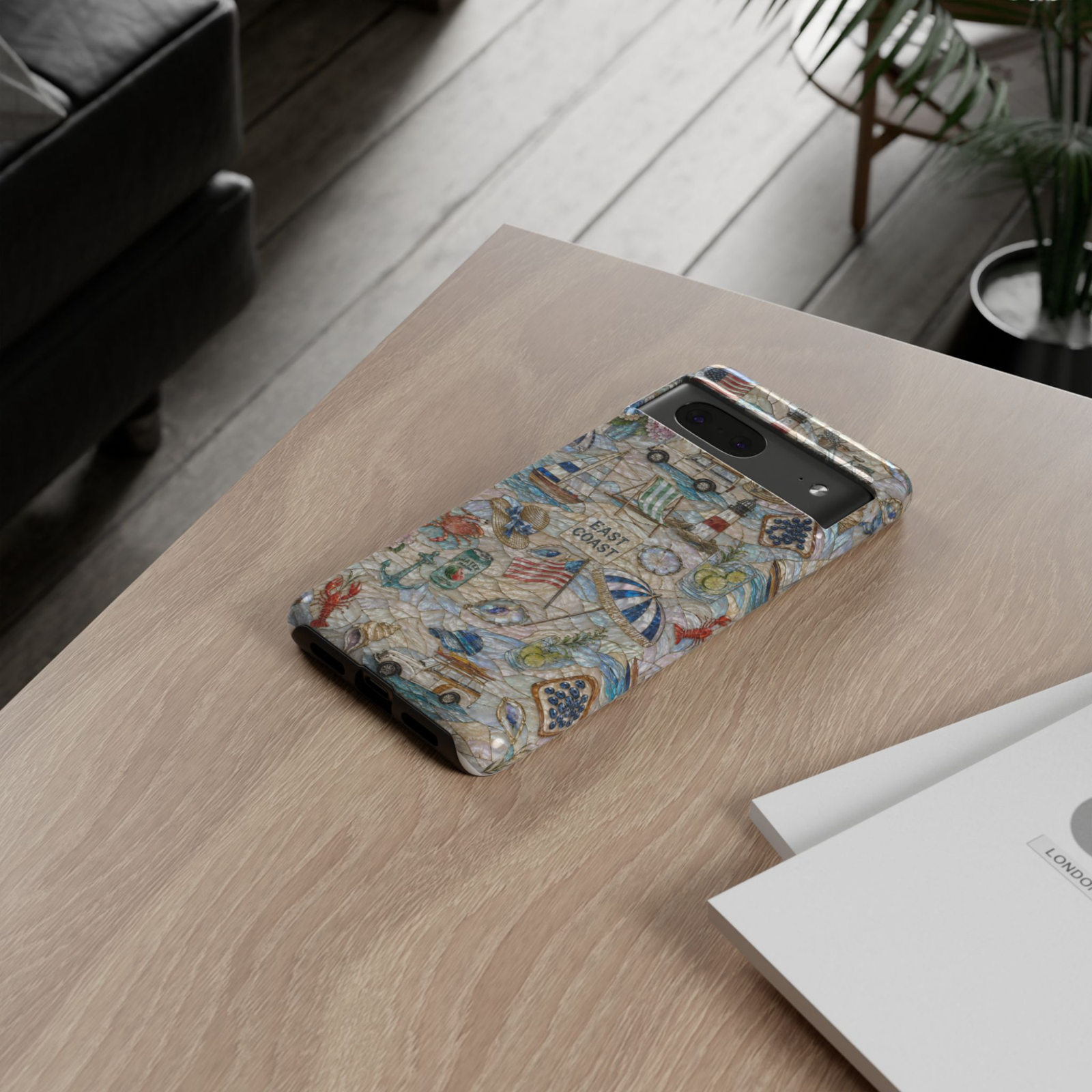 Protective Google Pixel 10 Pro phone case featuring sailboats, lighthouses, beach umbrellas, seashells, anchors, vintage beach wagons, and coastal summer artwork with durable dual-layer protection.