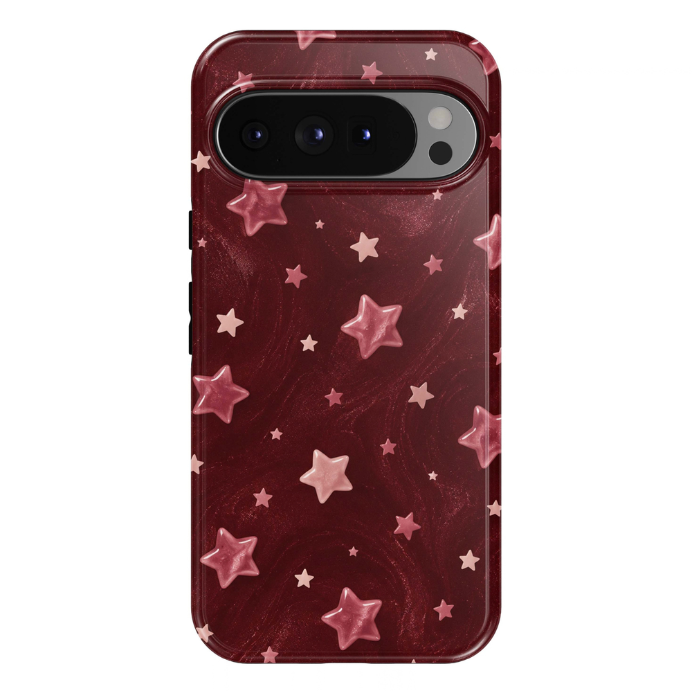 Blushing Stars Google Pixel phone case featuring glossy pink stars in assorted sizes on a deep burgundy background with a subtle printed shimmer effect.