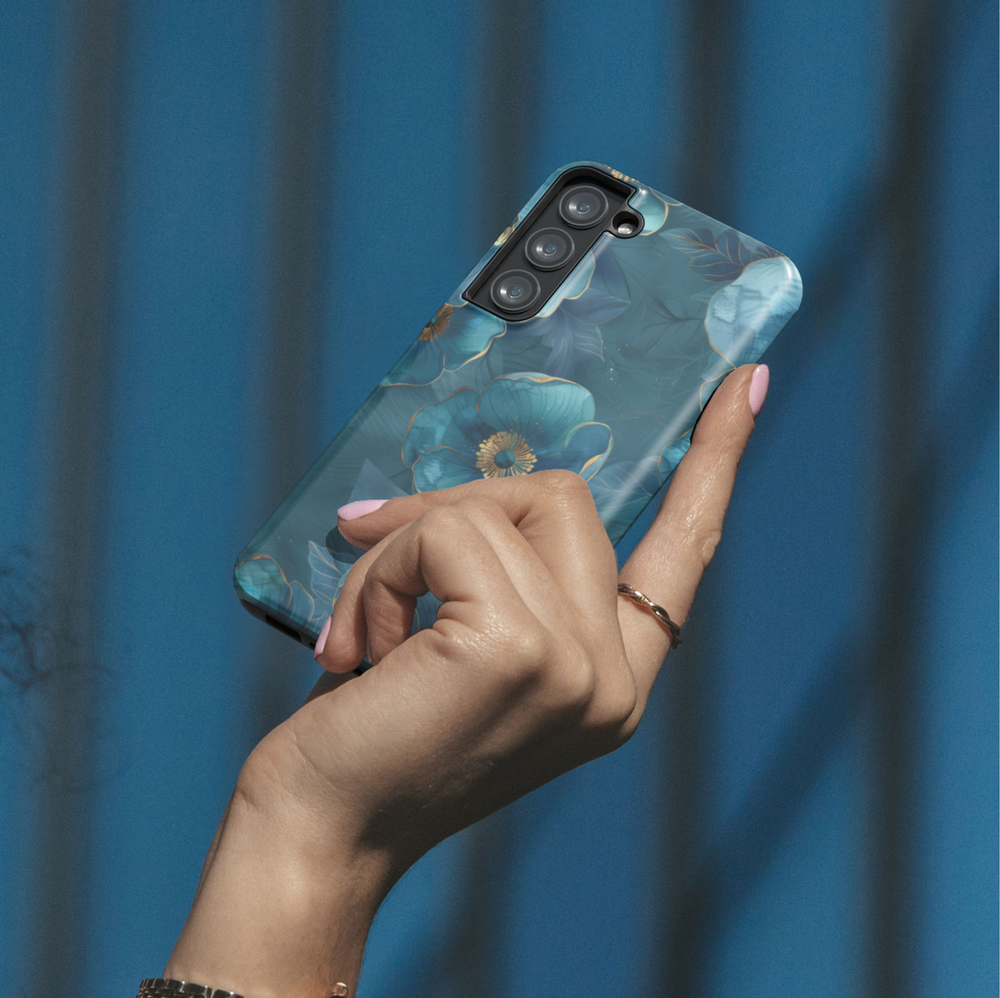 Blue floral phone case with gold accents and elegant botanical flower design for iPhone and Samsung