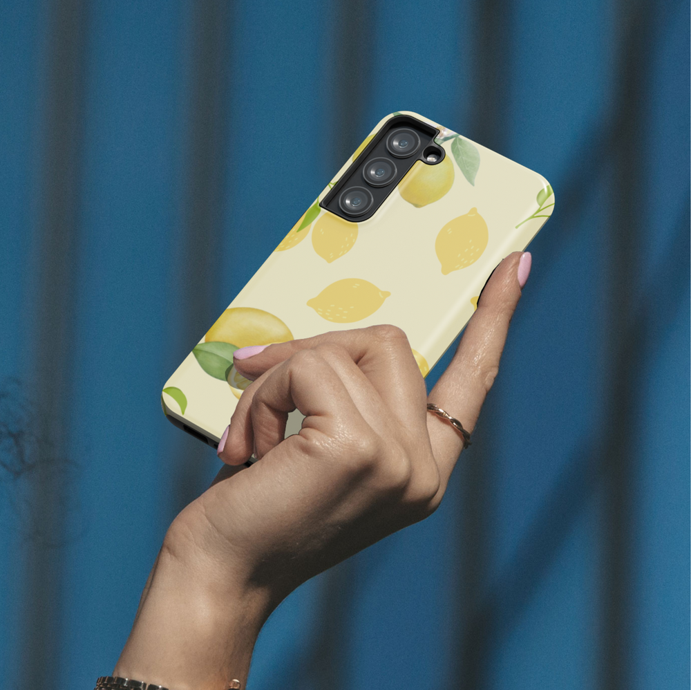 Samsung Galaxy phone case with watercolor lemon pattern and leaves on a light yellow background. Compatible with Galaxy S24 Ultra, S24 Plus, and S23 FE. Refreshing citrus design.